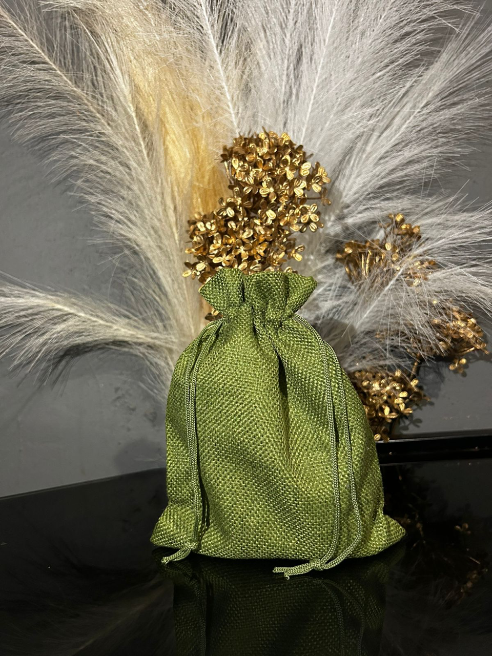 Olive green WM&R Naturals gift bag prepared for a customer